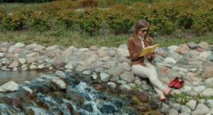 reading by the stream